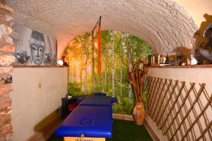 a table in a room with a painting on the wall at Al Seminario in Tivoli