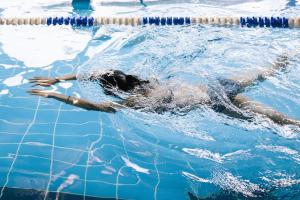 a person in the water in a swimming pool at Village Hotel Reading in Reading