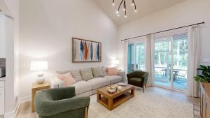 a living room with a couch and two chairs at Milos Haven house with community pool in Frankford