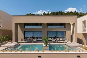 a rendering of a house with a swimming pool at Aeolia Residences in Nea Potidaea