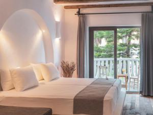 a bedroom with a large bed and a balcony at Deluxe Rooms Pet Friendly in Fethiye +29 photos