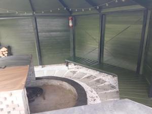 an outdoor shelter with stairs and a bench at Holiday Home Calli by Interhome in Give