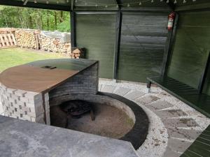 a patio with a brick oven in a yard at Holiday Home Calli by Interhome in Give
