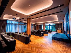 a banquet hall with black tables and chairs at Pullman Singapore Hill Street in Singapore +115 photos