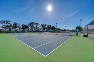 a tennis court with a tennis court at Steps to Brigantine Beach: New Jersey Beach Condo in Brigantine