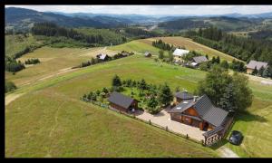 an aerial view of a large house in a field at Nasza Chata in Jaworzynka