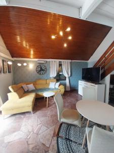 a living room with a couch and a table at Buda Weekend House in Budapest