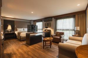 a hotel room with a bed and a couch at Hotel Park10 in Medellín +80 photos