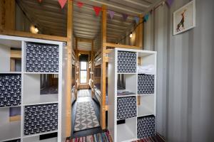 a room with two sets of bunk beds at Container 1, Camp Tapnell in Yarmouth