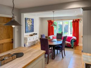 a kitchen and dining room with a table and chairs at St Anthonys in Ampleforth