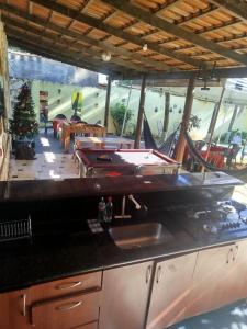 a kitchen with a pool table on a counter at Casa com Natureza in Goiânia