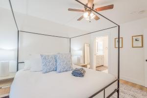 a bedroom with a white bed with a ceiling fan at 72 S Orem Upstairs Only in Orem