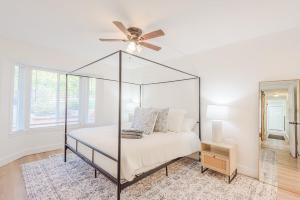 a bedroom with a bed with a ceiling fan at 72 S Orem Upstairs Only in Orem