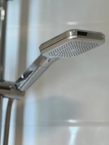 a close up of a metal shower head at Uferglanz - Balcony, view, sparkling wine, snacks in Koblenz