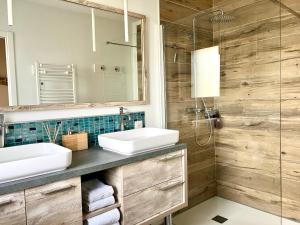 a bathroom with two sinks and a shower at Pavillon d'Éole in Berck-sur-Mer +43 photos