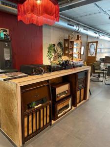 a counter in a room with wooden cabinets at Hotel Aan Zee in De Panne +55 photos