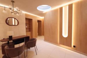 a dining room with a table and chairs at Best Western Plus Le Picardy Hotel & Spa in Saint-Quentin