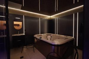 a bathroom with a sink and a mirror at Best Western Plus Le Picardy Hotel & Spa in Saint-Quentin