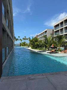 a swimming pool in the middle of a building at Gav Resorts in Ipojuca