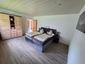 a large bedroom with a bed and a closet at Ferienhaus Schwerte Ergste im Ruhrtal in Schwerte +22 photos