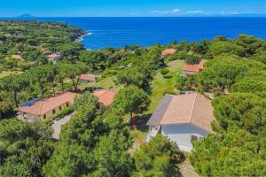 an aerial view of a house with the ocean in the background at Villa Artistica in Trappola