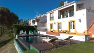 a house with a swimming pool in the backyard at Casa da Barragem - Castelo de Bode in Castelo do Bode