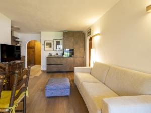 a living room with a couch and a table at Apartment Villa Adele by Interhome in Madesimo
