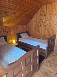 a room with two beds in a cabin at Mountain house Savin Kuk in Žabljak