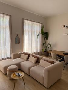 a living room with a couch and a table at Loft09 Exclusive Suite in Lagonegro