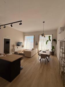 a living room with a couch and a table at Loft09 Exclusive Suite in Lagonegro