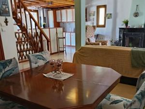 a dining room with a table with glasses on it at Thalia in Perea