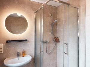 a bathroom with a shower and a sink at Doras Ferienhaus in Bad Reichenhall +31 photos