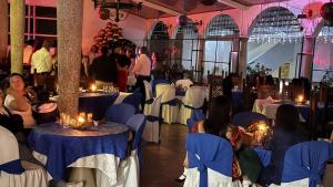 a group of people sitting at tables in a restaurant at Hotel Turístico de Tenza in Tenza +34 photos