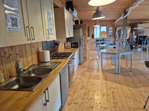 a kitchen with a sink and a counter top at Yourte in Les Hogues