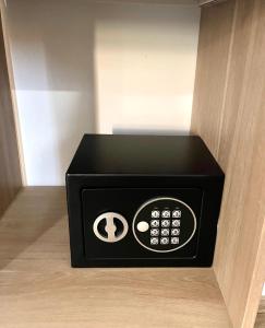 a black box with a calculator in a room at Les Anges de Sigean, Chambres d'hôtes de Luxe,Rooftop Panoramique avec Jacuzzi in Sigean