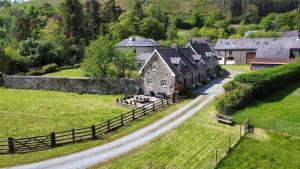 an aerial view of a house in a field at Abbey Cottages Buzzards Watch in Talley