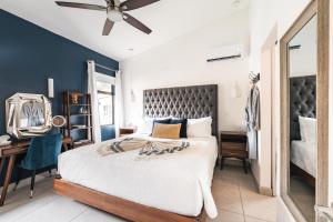 a bedroom with a large bed and a ceiling fan at Coco Garden Suites in Coco +151 photos