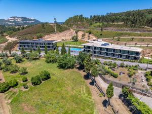 an aerial view of a building on a hill at Lima Riverview Suites in Ponte de Lima