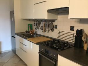 a kitchen with a sink and a stove top oven at My house in Turin
