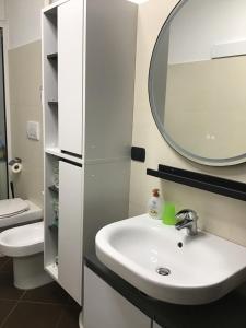 a bathroom with a sink and a mirror at My house in Turin