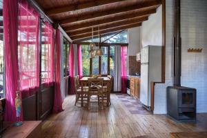a dining room with a table and a stove at Complejo Aramis Chapadmalal in Chapadmalal +112 photos