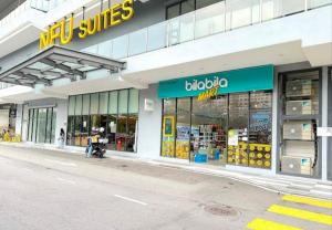 a store front of a store with a motorcycle parked outside at Blue aura in Kuala Lumpur