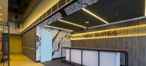 a lobby with a new suites sign on a wall at Blue aura in Kuala Lumpur +1 photo