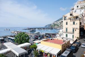 a view of a city with a harbor at Bambagina Mare in Amalfi