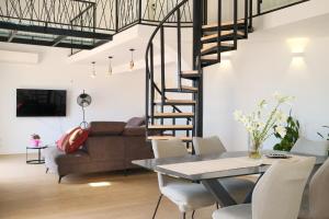 a living room with a couch and a table at Apartmani Zora in Primošten
