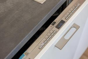a close up of the control panel of a dishwasher at Ferienhaus Primavera in Mörsdorf