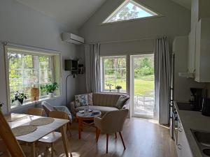 a living room with a couch and a table at Stora Frögården in Mörbylånga