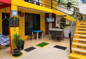a lego house with a table and a desk at Carey Lodging in Tortuguero