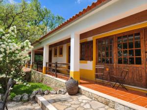 a house with a yellow and white facade at Quinta do Vale Encantado "the Valley" - Santarém - Portugal in Calhariz