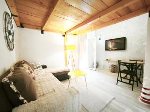 a living room with a couch and a table at Apartmani Vukovic in Budva